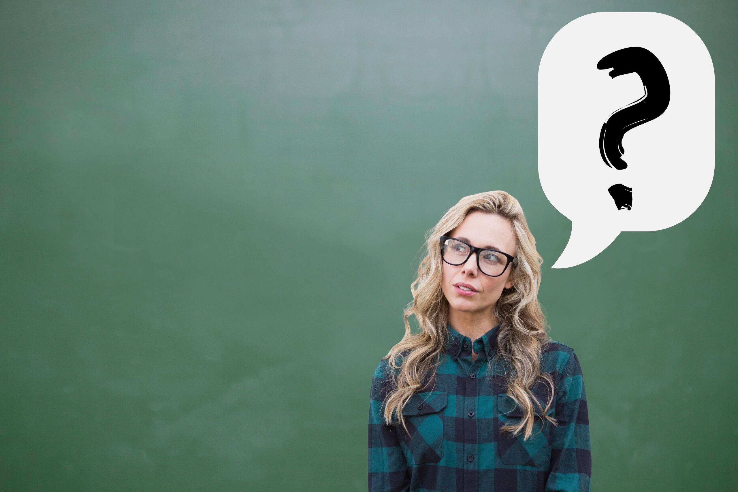 A thoughtful young woman with glasses standing in front of a green chalkboard with a large question mark in a thought bubble above her head