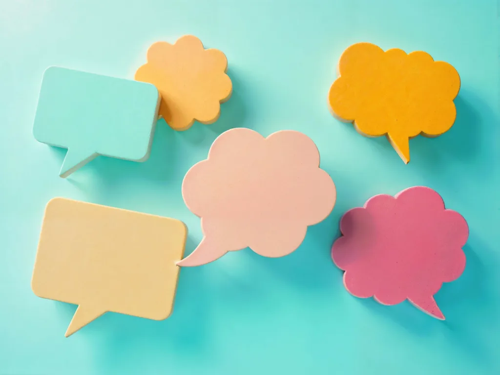 A light blue background with various brightly coloured 3D speech bubbles and thought bubbles.