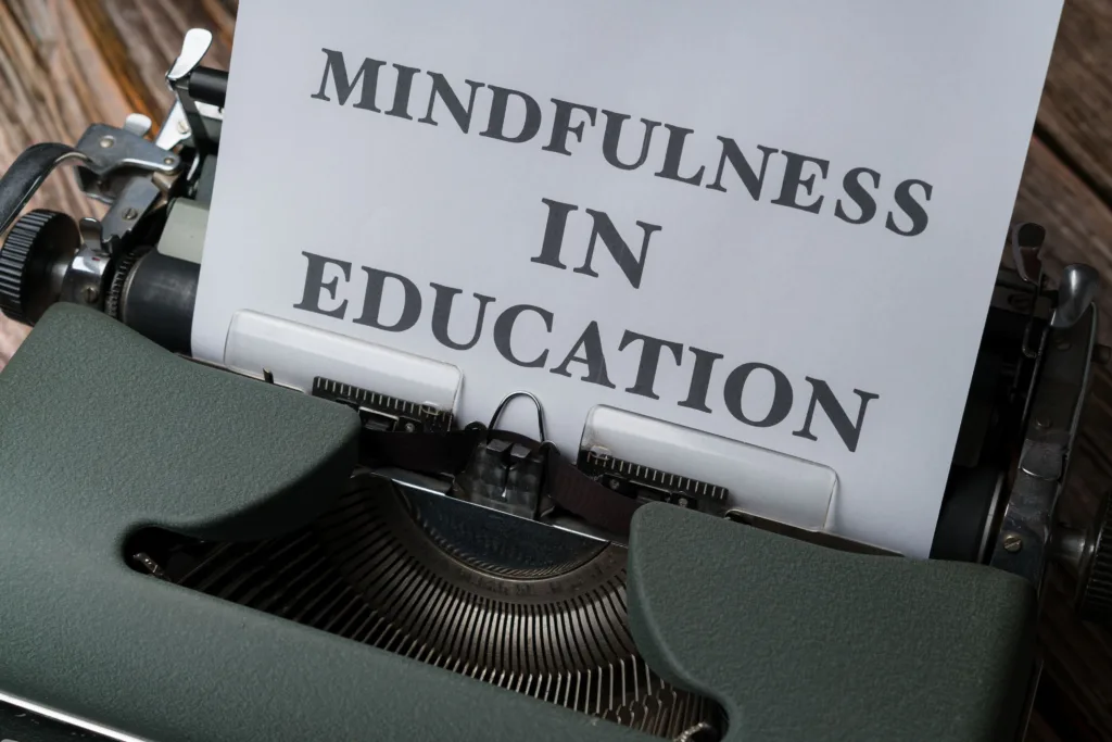 Close-up of a vintage typewriter with 'Mindfulness in Education' paper